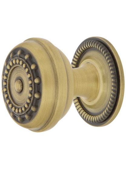 Meadows Cabinet Knob - 1 3/8 inch Diameter with Rope Rosette in Antique Brass.